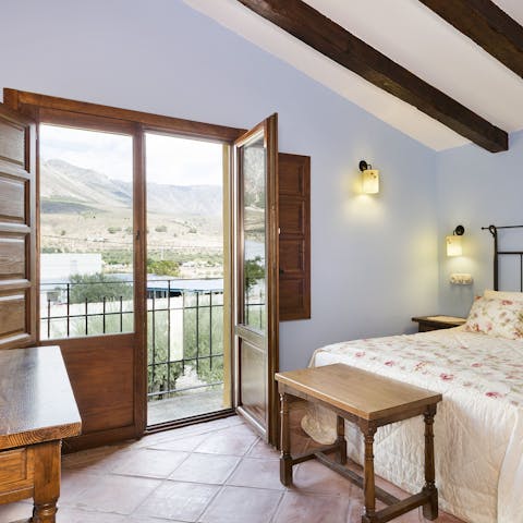 Gaze out across the landscape to the mountains from your bedroom