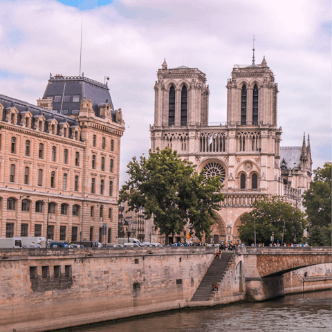 Stroll along the Seine to the iconic Notre-Dame