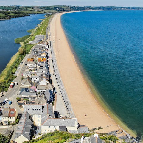 Stroll along the three miles of shingle beaches from the front door of your home