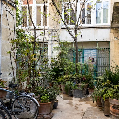 Enjoy access through the peaceful, plant-filled courtyard