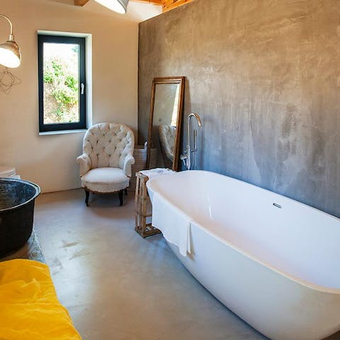 Treat yourself to a rejuvenating session in the freestanding bathtub