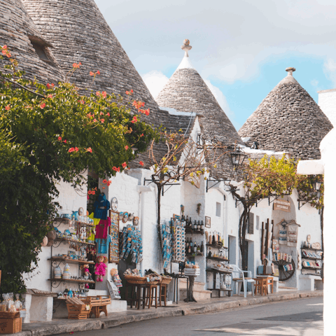 Wander the sloping streets of Alberobello and admire the famous conical roofs and whitewashed walls