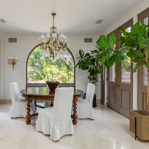 Enjoy a cup of coffee as you admire the garden through the arching window