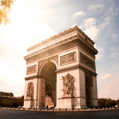 Start your sightseeing at the Arc de Triomphe, twenty minutes on foot
