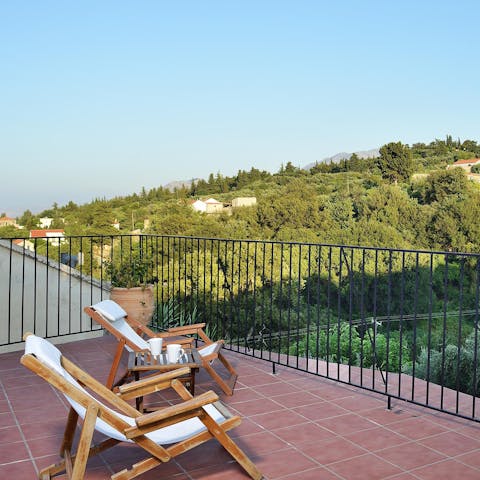 Unwind on the roof terrace with a glass of wine and idyllic views