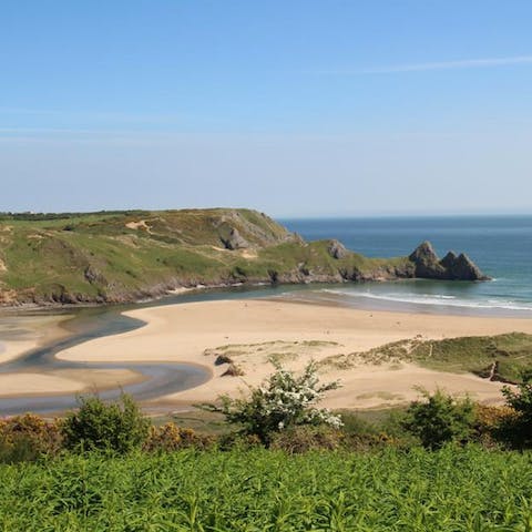 Soak up the sun at Oxwich Bay beach, just a fifteen-minute walk away