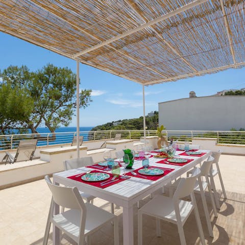 Drink in the sea views as you dine alfresco under the pergola