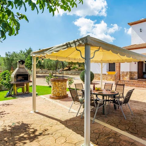 Grill in the garden and dine alfresco on the covered terrace