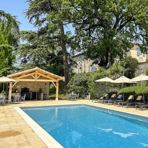 Lie back on the poolside sun loungers as the kids splash in the private pool