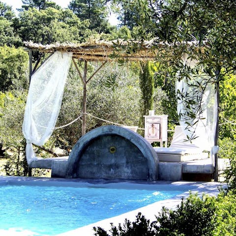 Cool off with a refreshing swim in the private outdoor pool, complete with water feature