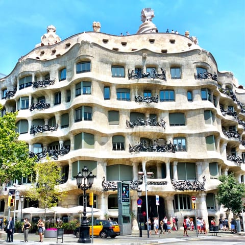 Take a three-minute walk to the visit the incredible Casa Milà