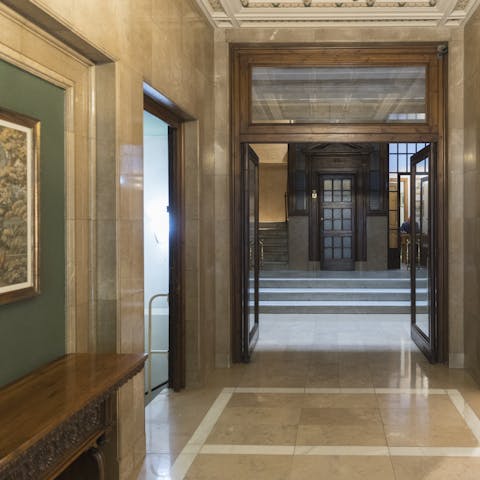 Arrive in style at the majestic marble entrance to the building
