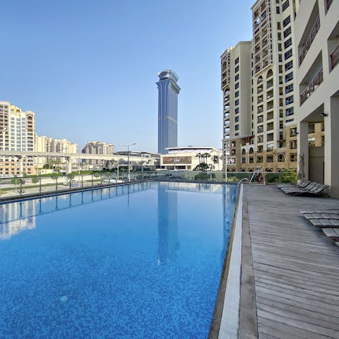 Dive into the cooling waters of the communal pool