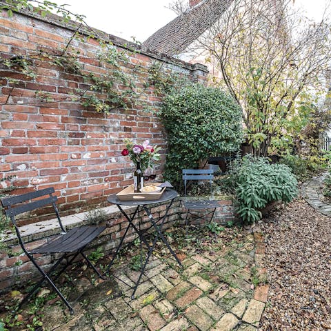 Enjoy a glass of wine in the pretty patio garden after a scenic country stroll