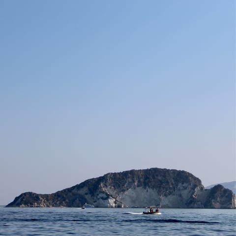 Hop on a boat and head on over to the neighbouring island of Marathonissi (Turtle Island)