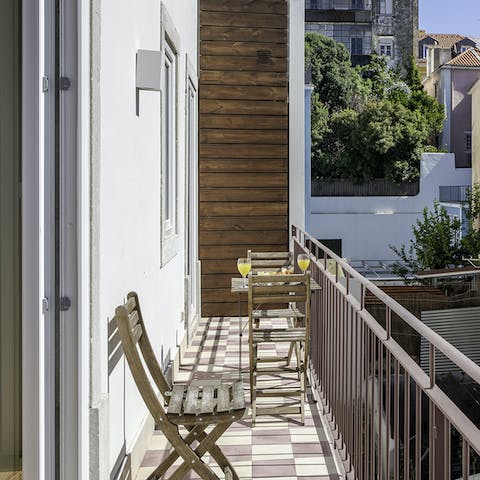 Start mornings off with a coffee and pastéis de nata on the private balcony