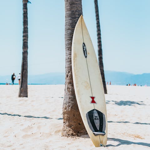 Surf the sea waves at one of the nearby beaches 