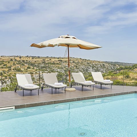 Relax on a sun lounger by your pool