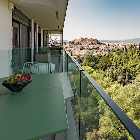 Admire the stunning Acropolis and city skyline views from your private balcony