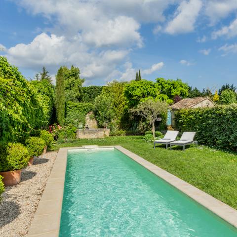 Relax by the pool in the pretty, enclosed garden