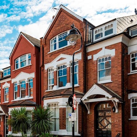 Admire the classic, red-brick Victorian homes lining your leafy street