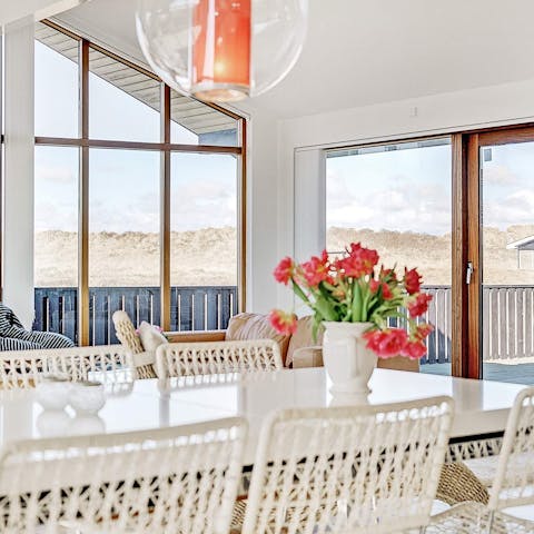 Dine on Danish classics like smørrebrød and fried pork belly as you admire the views of the sand dunes