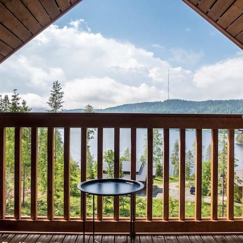 Admire the picturesque views from the cabin's balcony