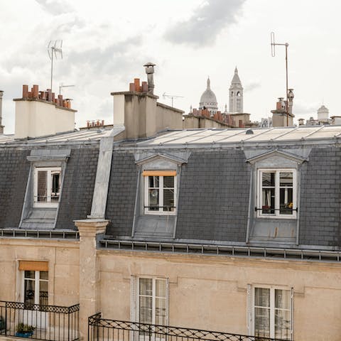 Glimpse the top of the Sacré Coeur from your attic apartment