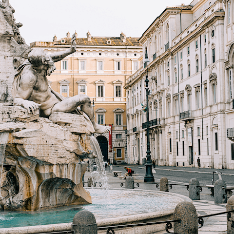 Walk down to the bustling Piazza Navona and its majestic fountains