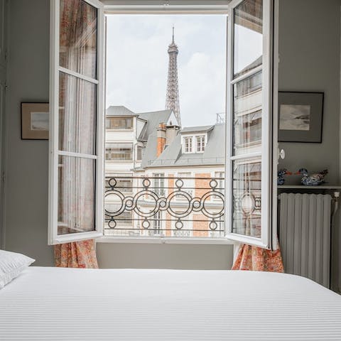 Wake up to enviable views of the Eiffel Tower from the main bedroom