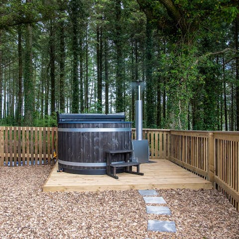 Relax in the wood fired hot tub, sipping on a glass of wine and looking out at the incredible view