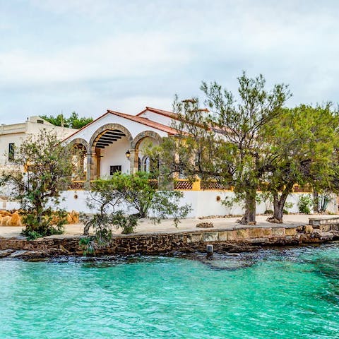 Step out from the villa and right into the turquoise sea waters  