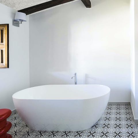 Treat yourself to a luxurious bubble bath in one of the sleek bathrooms