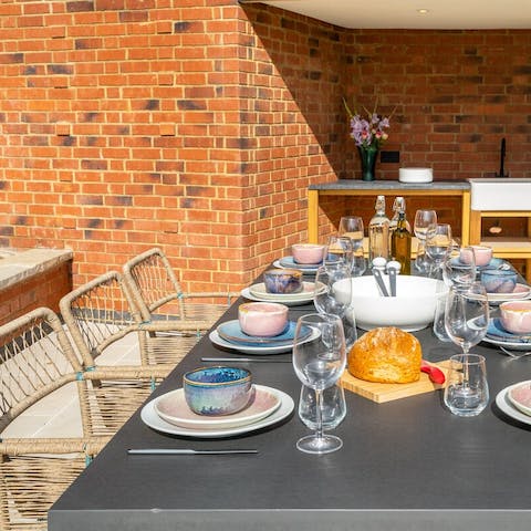 Tuck into a delicious alfresco feast in the summer kitchen