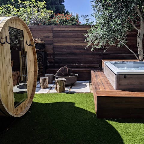 Rejuvenate and restore in the amazing backyard spa area complete with sauna, hot tub and fire pit