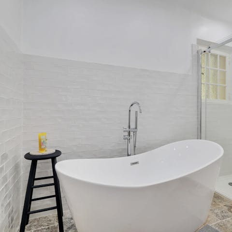 Make time for a long soak in the freestanding bathtub