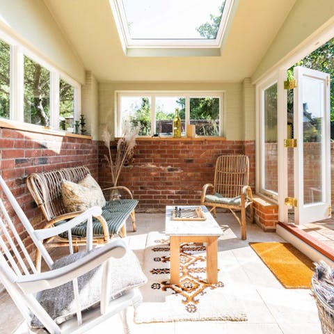 Retreat to the sun room with a good book and a mug of tea