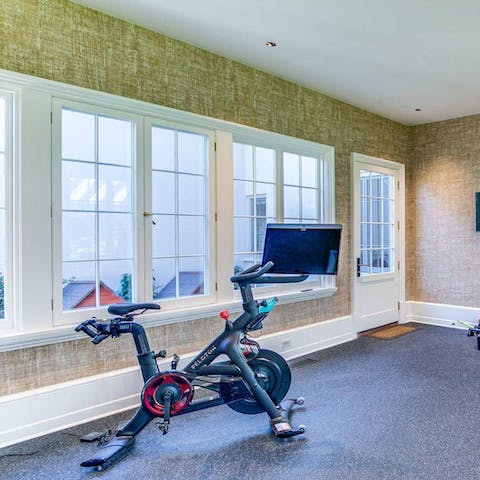 Sweat it out on the exercise bike in the at-home gym area