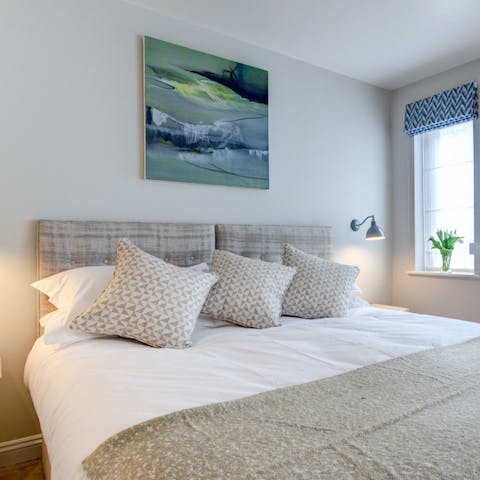 Settle in for a good night's sleep in the comfy bedroom after a day on the beach