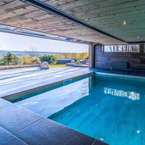 Admire your rolling hillside views from your panoramic-viewed pool