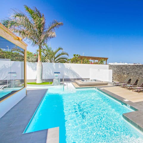 Swim in the cool pool that wraps around the villa