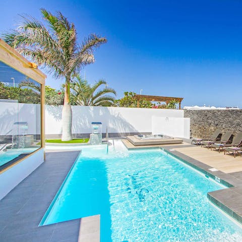 Swim in the cool pool that wraps around the villa