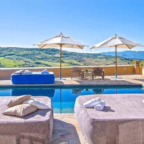 Soak up the sunshine and drink in the countryside views from the private pool