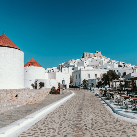 Walk past the old-fashioned windmills up to the hilltop Castle of Astypalea
