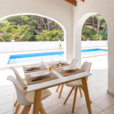 Tuck into delicious home-cooked meals around the alfresco dining set