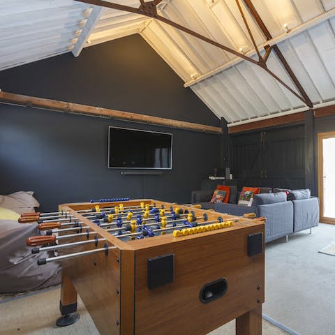 Play table football or stream a movie on the TV in the lively games room