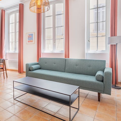 Stretch out in the living area after a day of discovering the city