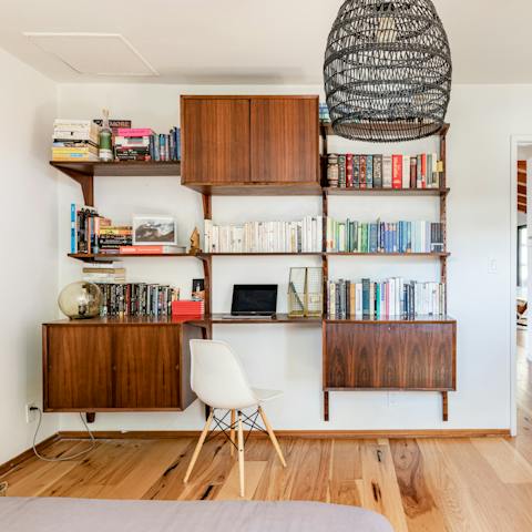 Get a spot of work done at the book-filled desk in the second bedroom