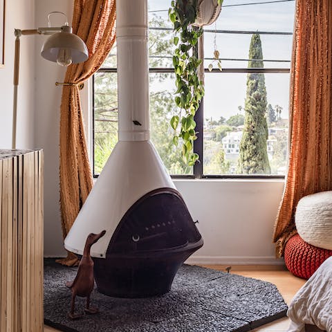 Fire up the funky wood burner in the bedroom on cooler nights