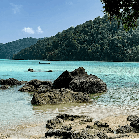 Discover the crystal-clear waters of Surin Beach – just a short stroll away